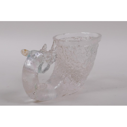 160 - A Chinese moulded glass libation cup with mythical creature decoration, 12cm long