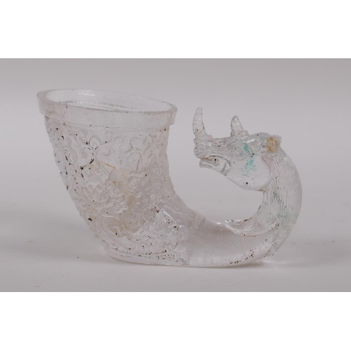 160 - A Chinese moulded glass libation cup with mythical creature decoration, 12cm long