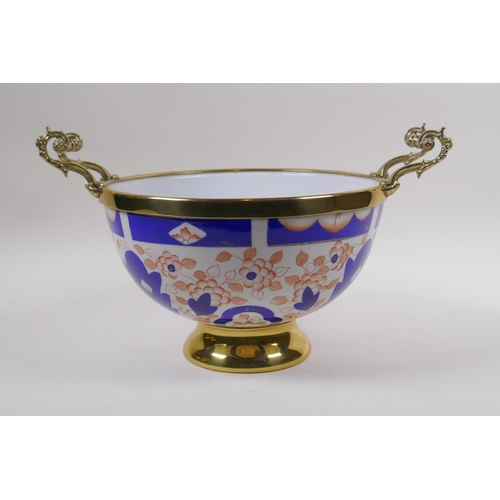 164 - A brass mounted porcelain bowl/centrepiece, decorated in the Imari palette, 24cm diameter, mark to b... 