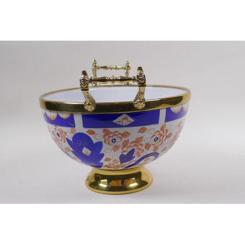 164 - A brass mounted porcelain bowl/centrepiece, decorated in the Imari palette, 24cm diameter, mark to b... 