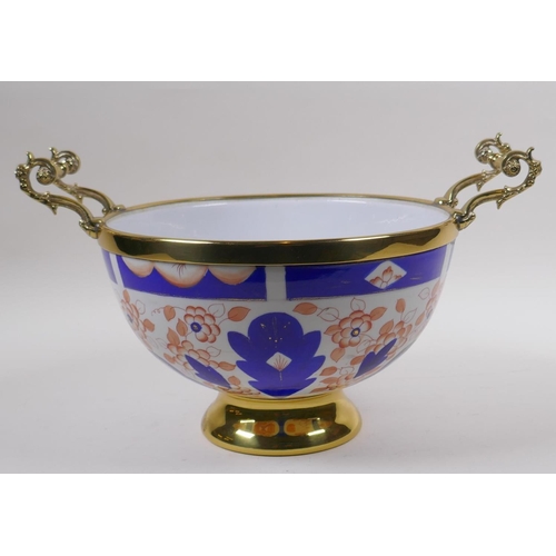 164 - A brass mounted porcelain bowl/centrepiece, decorated in the Imari palette, 24cm diameter, mark to b... 