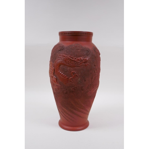 166 - A Japanese redware vase with raised dragon decoration, impressed mark to base, 30cm high