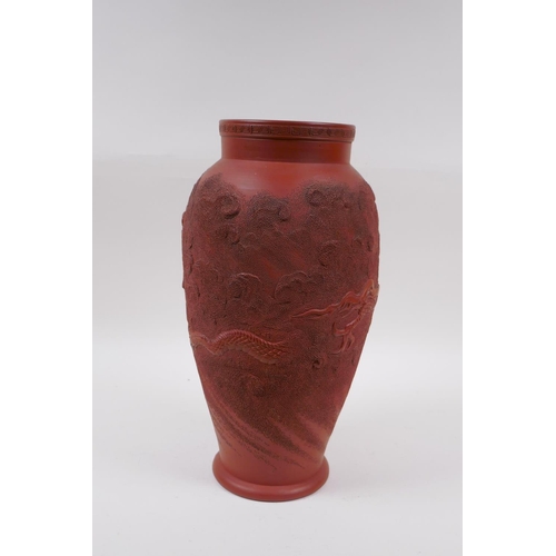 166 - A Japanese redware vase with raised dragon decoration, impressed mark to base, 30cm high