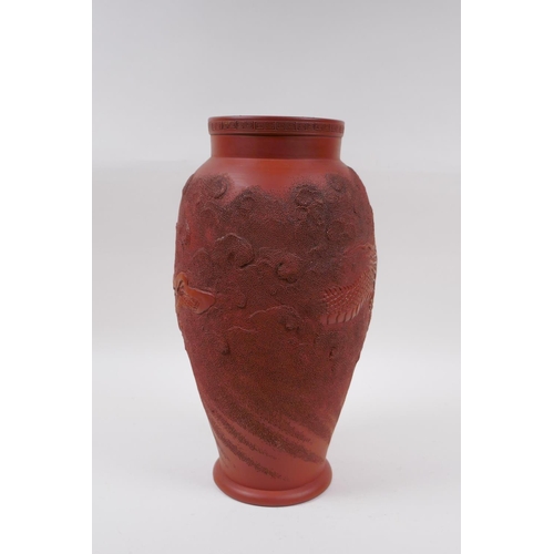 166 - A Japanese redware vase with raised dragon decoration, impressed mark to base, 30cm high