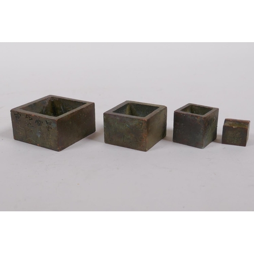 170 - A nest of four Chinese bronze seals, 4 x 4cm