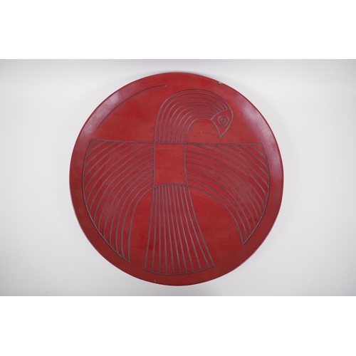 18 - A Chinese red Tixi lacquer charger with stylised bird decoration, Xuande 4 character mark to base, 4... 