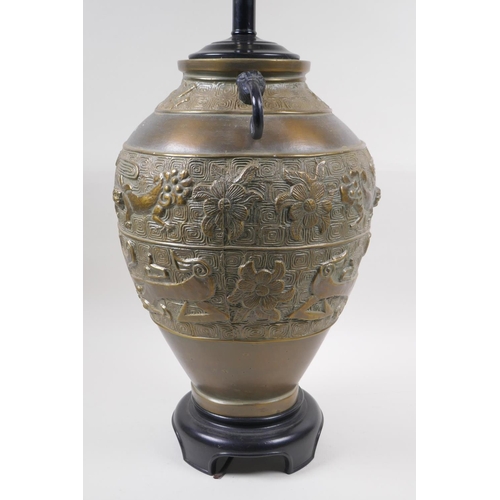 181 - A Chinese brass two handled vase with archaic style kylin decoration, converted to a lamp, 50cm high