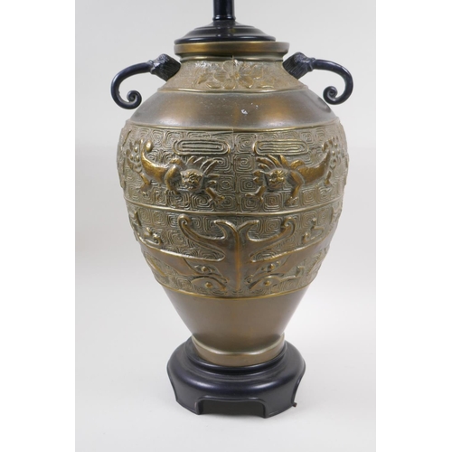 181 - A Chinese brass two handled vase with archaic style kylin decoration, converted to a lamp, 50cm high