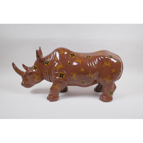 182 - A painted composition rhino with LV style decoration, 52cm long