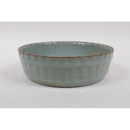 188 - A Chinese celadon crackle glazed porcelain bowl of ribbed form, 18cm diameter