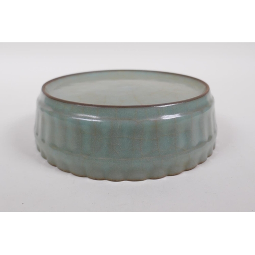 188 - A Chinese celadon crackle glazed porcelain bowl of ribbed form, 18cm diameter