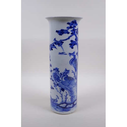 19 - A Chinese late C19th/early C20th blue and white porcelain cylinder vase decorated with a phoenix and... 