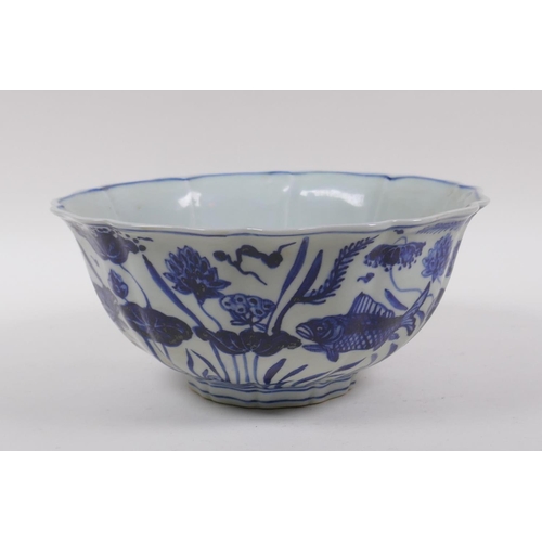 198 - A blue and white porcelain bowl of lobed form, decorated with carp in a lotus pond, Chinese Xuande 6... 