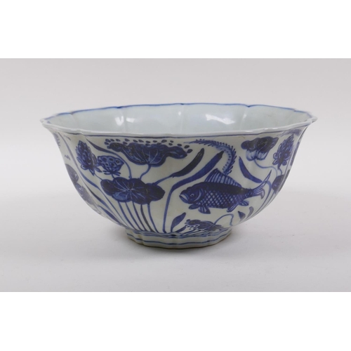 198 - A blue and white porcelain bowl of lobed form, decorated with carp in a lotus pond, Chinese Xuande 6... 