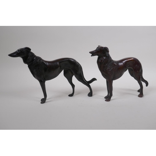 199 - A pair of cast bronze hounds, 26cm long