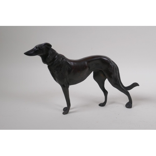 199 - A pair of cast bronze hounds, 26cm long