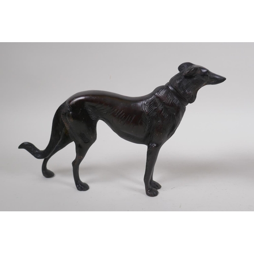 199 - A pair of cast bronze hounds, 26cm long