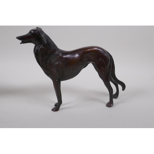 199 - A pair of cast bronze hounds, 26cm long