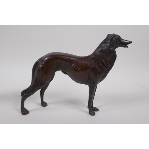 199 - A pair of cast bronze hounds, 26cm long