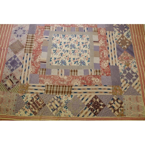 2 - A Victorian/early C20th hand stitched patchwork quilt, 250 x 218cm