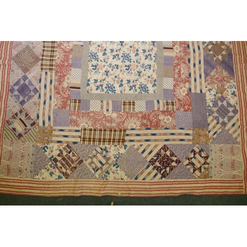 2 - A Victorian/early C20th hand stitched patchwork quilt, 250 x 218cm