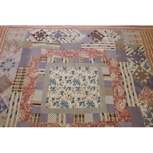 2 - A Victorian/early C20th hand stitched patchwork quilt, 250 x 218cm