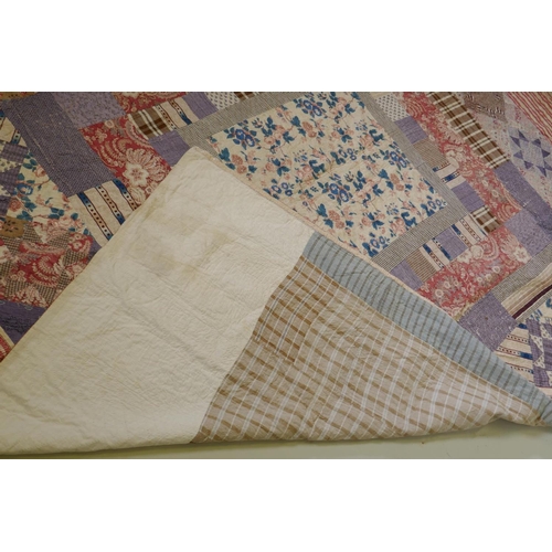 2 - A Victorian/early C20th hand stitched patchwork quilt, 250 x 218cm