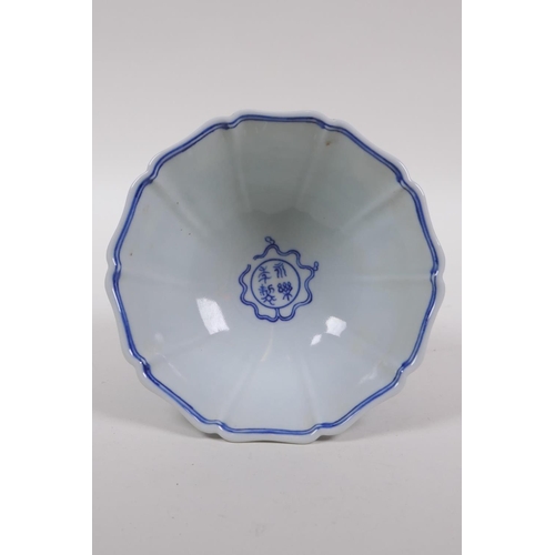 200 - A Chinese blue and white porcelain stem bowl of lobed form decoration with dragons, Yongle mark to t... 