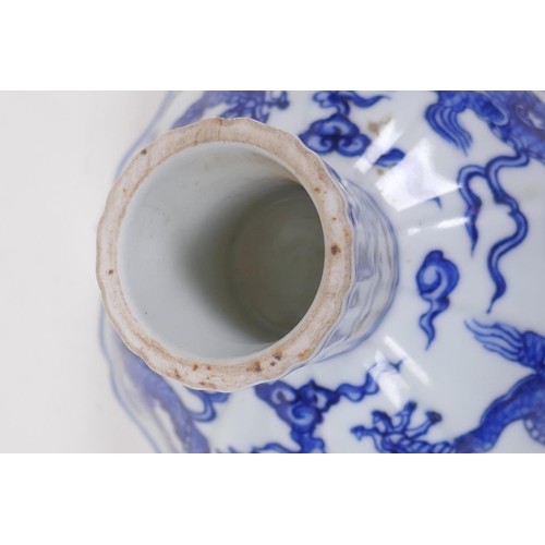 200 - A Chinese blue and white porcelain stem bowl of lobed form decoration with dragons, Yongle mark to t... 