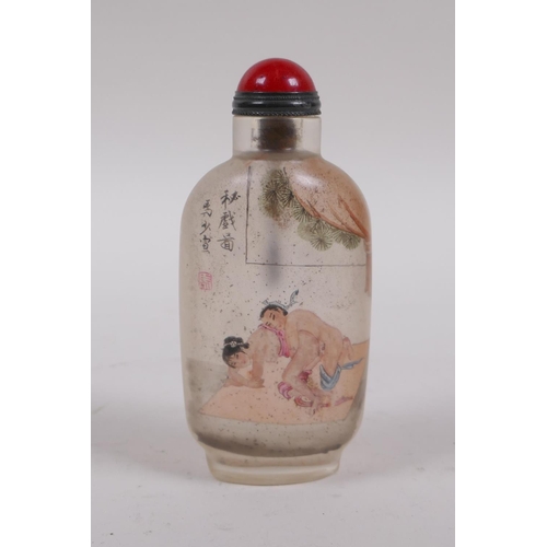 205 - A Chinese reverse decorated glass snuff bottle depicting an erotic scene, inscription verso, 10cm hi... 