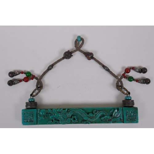 206 - A Chinese turquoise glass scroll weight hanger decorated with a dragon chasing the flaming pearl, 23... 