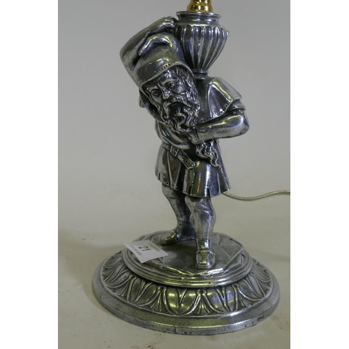 21 - An antique chrome plated figural lamp in the form of a dwarf bearing an urn, converted to electricit... 