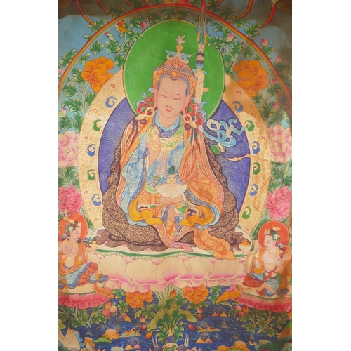 214 - A Tibetan printed thangka within a silk surround, 78 x 110cm