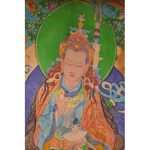 214 - A Tibetan printed thangka within a silk surround, 78 x 110cm