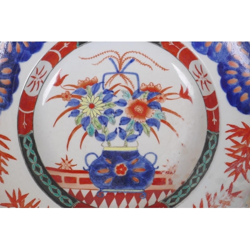 223 - A Chinese republic porcelain dish with floral decoration in the Imari palette, 27cm diameter, AF rep... 