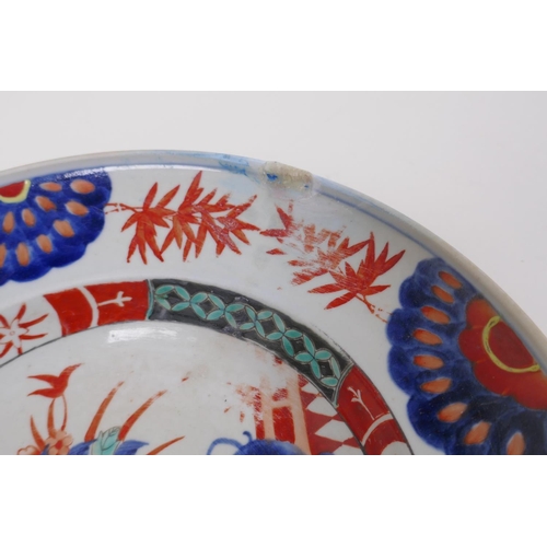 223 - A Chinese republic porcelain dish with floral decoration in the Imari palette, 27cm diameter, AF rep... 