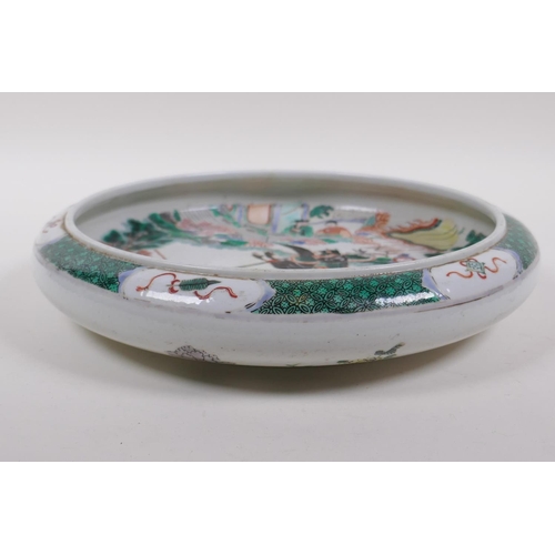 225 - A famille vert porcelain charger with rolled rim, decorated with warriors on horseback, Chinese Kang... 