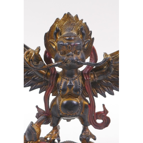 238 - A Tibetan bronze of Garruda with painted and gilt highlights, 18cm high