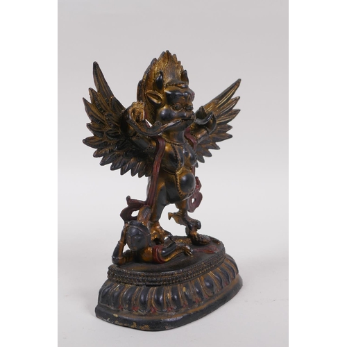 238 - A Tibetan bronze of Garruda with painted and gilt highlights, 18cm high