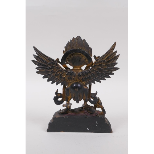 238 - A Tibetan bronze of Garruda with painted and gilt highlights, 18cm high