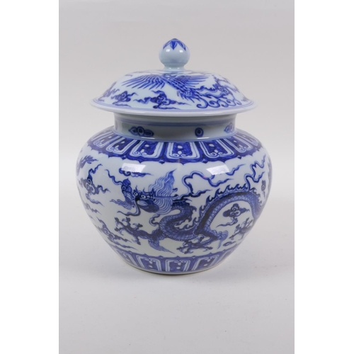 241 - A blue and white porcelain ginger jar and cover with dragon and phoenix decoration, Chinese Xuande 6... 