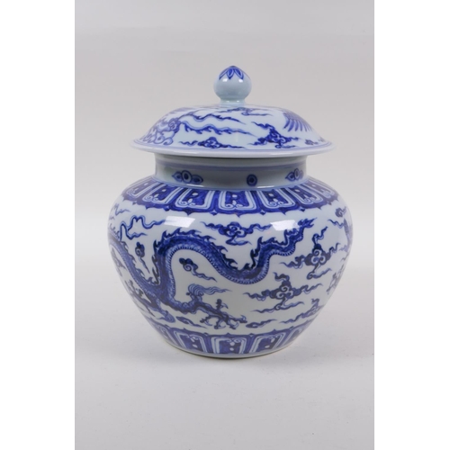 241 - A blue and white porcelain ginger jar and cover with dragon and phoenix decoration, Chinese Xuande 6... 