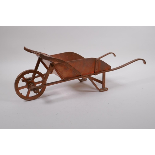 244 - A well constructed copper model of a wheelbarrow, 17