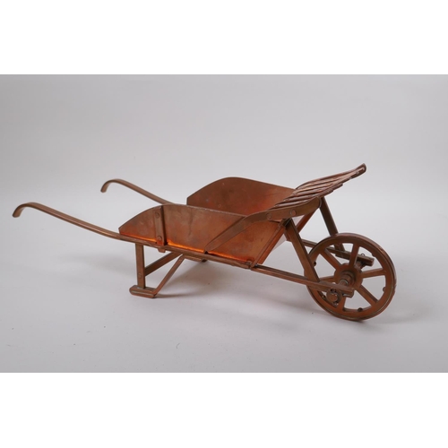 244 - A well constructed copper model of a wheelbarrow, 17