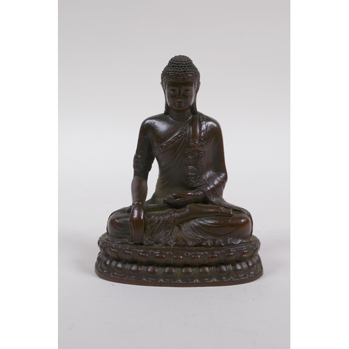 251 - A bronze figure of Buddha seated in mediation, 9cm high