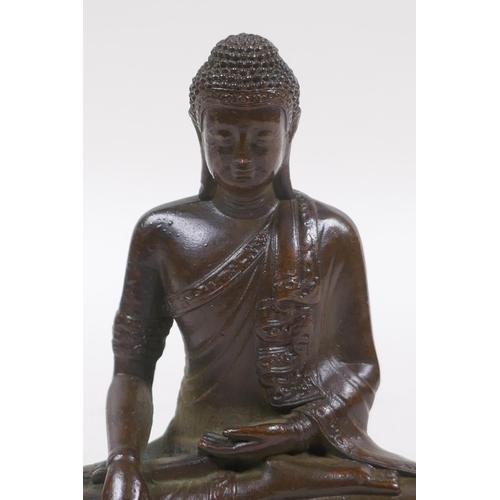 251 - A bronze figure of Buddha seated in mediation, 9cm high