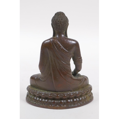 251 - A bronze figure of Buddha seated in mediation, 9cm high