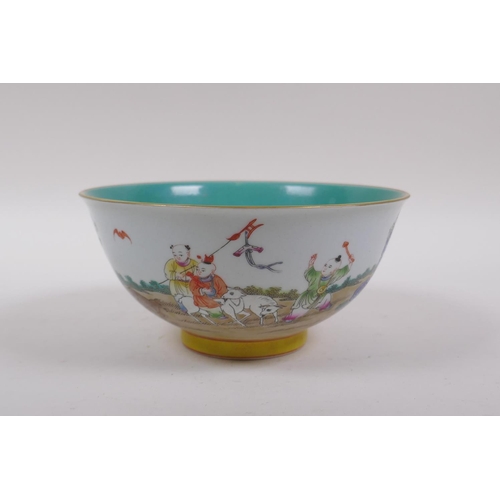 258 - A polychrome porcelain rice decorated with children playing in a garden, and a turquoise interior, C... 