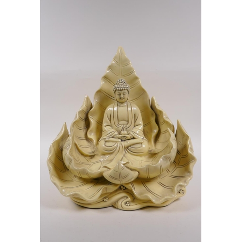 260 - A Chinese blanc de chine porcelain figure of Buddha seated within a blooming lotus flower, impressed... 