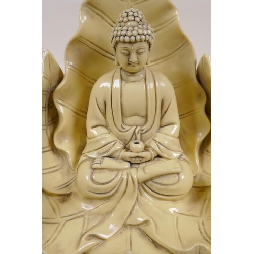 260 - A Chinese blanc de chine porcelain figure of Buddha seated within a blooming lotus flower, impressed... 